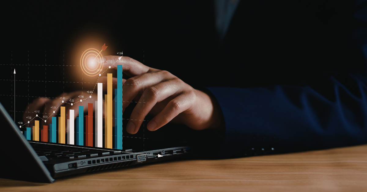 Fingers on keyboard showing bar chart